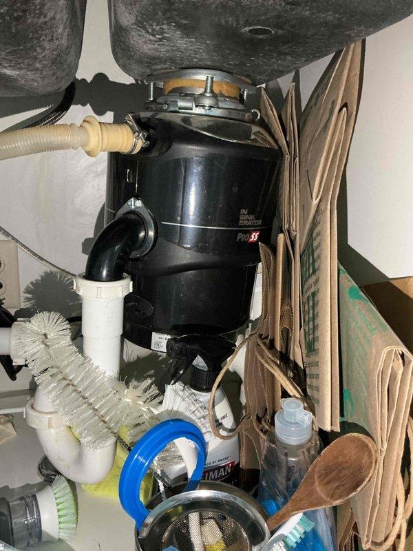 Completed comprehensive plumbing inspection including water heater maintenance service consisting of draining and refilling unit per customer request upon new membership enrollment. Inspected kitchen plumbing components including garbage disposal, P-trap assembly, and drain line connections, all found to be in proper working order with no leaks or deficiencies observed.