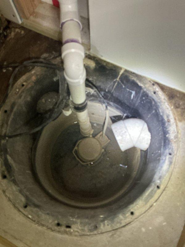 Responded to service call for non-functioning sump pump with standing water in basin. Upon inspection, determined existing pump had failed and was no longer operational. Removed defective sump pump unit from basin and installed new replacement pump with proper float switch assembly. Installed new check valve on discharge line to prevent backflow. Tested system operation to verify proper pumping function and automatic float activation. System now operating correctly with basin draining as designed.