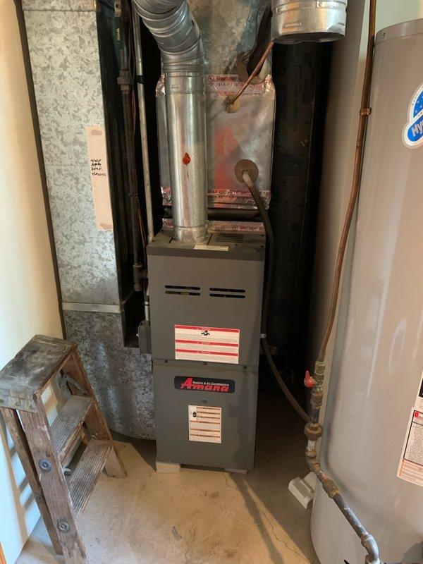 Responded to no cooling call on 12-year-old Amana system. Found compressor and condenser fan motor not operating while indoor unit and thermostat functioned normally. Performed diagnostic testing and measured refrigerant pressures, which revealed system was significantly low on charge. Pressure readings and leak assessment indicated a substantial refrigerant leak in the system. System utilizes obsolete refrigerant type, making repair economically unfeasible. Discussed findings with customer and explained that due to the age of equipment, extent of refrigerant loss, obsolete refrigerant, and cost of repairs versus replacement, a new system installation would be the recommended solution. Scheduled replacement estimate appointment. Customer elected to proceed with system replacement rather than repair.