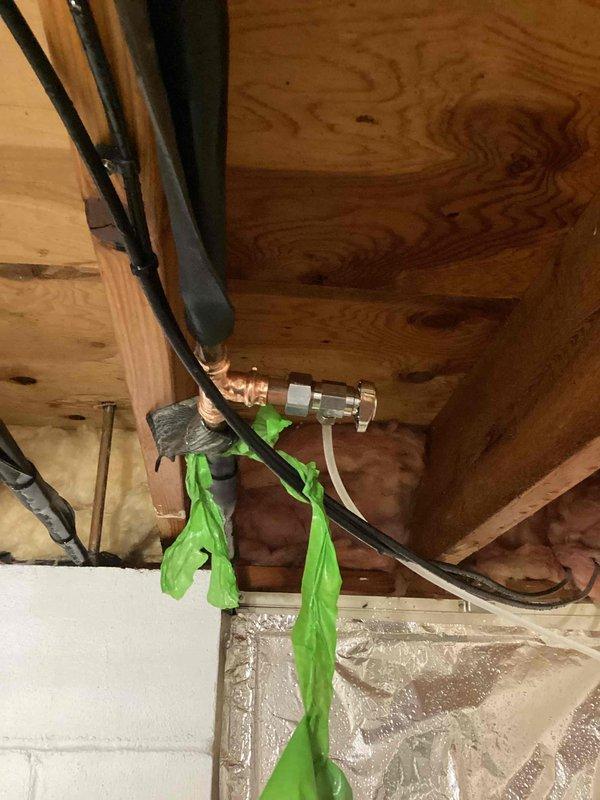 Responded to emergency water leak caused by failed outdoor spigot leaking into the interior of the home. The existing needle valve had broken and could not be shut off, including the main water supply valve. Successfully replaced the failed needle valve with a new compression valve, restoring proper shutoff capability and eliminating the active leak.