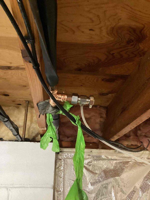 Responded to emergency water leak caused by failed outdoor spigot leaking into the interior of the home. The existing needle valve had broken and could not be shut off, including the main water supply valve. Successfully replaced the failed needle valve with a new compression valve, restoring proper shutoff capability and eliminating the active leak.