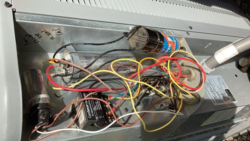 Responded to service call for HVAC unit experiencing repeated issues since installation. Replaced condenser fan motor and 70/5 dual run capacitor under parts and labor warranty, with parts obtained from warehouse. Upon cycling the system after component replacement, discovered the compressor was locked up and inoperable. Due to compressor failure, was unable to charge the system or add UV dye for leak detection as originally planned. Unit requires additional repair to address locked compressor before system can be fully restored to operational status.