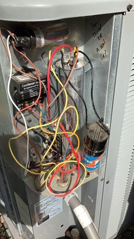 Responded to service call for HVAC unit experiencing repeated issues since installation. Replaced condenser fan motor and 70/5 dual run capacitor under parts and labor warranty, with parts obtained from warehouse. Upon cycling the system after component replacement, discovered the compressor was locked up and inoperable. Due to compressor failure, was unable to charge the system or add UV dye for leak detection as originally planned. Unit requires additional repair to address locked compressor before system can be fully restored to operational status.