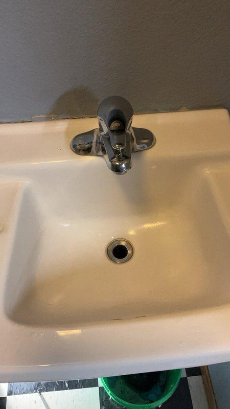 Responded to service call for slow-draining bathroom sink. Successfully cleared clog located in the trap and pop-up assembly using appropriate drain cleaning tools. Sink now drains properly at normal flow rate.