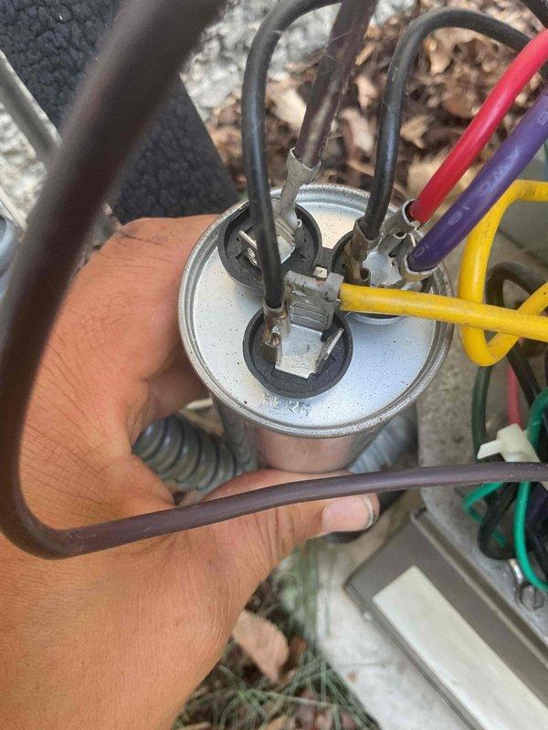 Responded to no cooling complaint on 10+ year old system. Found condenser fan motor not starting due to failed capacitor. Upon inspection, unit was also low on refrigerant charge. Replaced defective capacitor and evaluated system condition. Due to advanced age of equipment and refrigerant loss indicating potential leak, recommended unit replacement rather than pursuing repairs and refrigerant recharge on aging system.