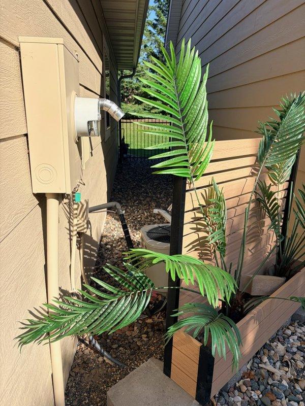 Responded to no cooling complaint on 20-year-old central air conditioning system. Upon inspection, found system low on refrigerant with indoor evaporator coil freezing during operation, resulting in blocked airflow and loss of cooling capacity. Verified issue using visual saturation temperature assessment showing ice buildup on coil. System contains obsolete refrigerant, making repair economically unfeasible. Documented equipment condition with photos of outdoor unit location and electrical panel. Recommended full system replacement due to age, refrigerant obsolescence, and extent of required repairs. Scheduled same-day estimate for new air conditioning installation.