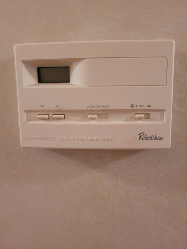 Replaced 20-year-old Robertshaw thermostat that was experiencing intermittent operation issues affecting system control reliability. Removed existing unit, installed new digital programmable thermostat with proper wire terminations to control board, verified heating and cooling functions operational. System tested and confirmed responsive to new thermostat commands.