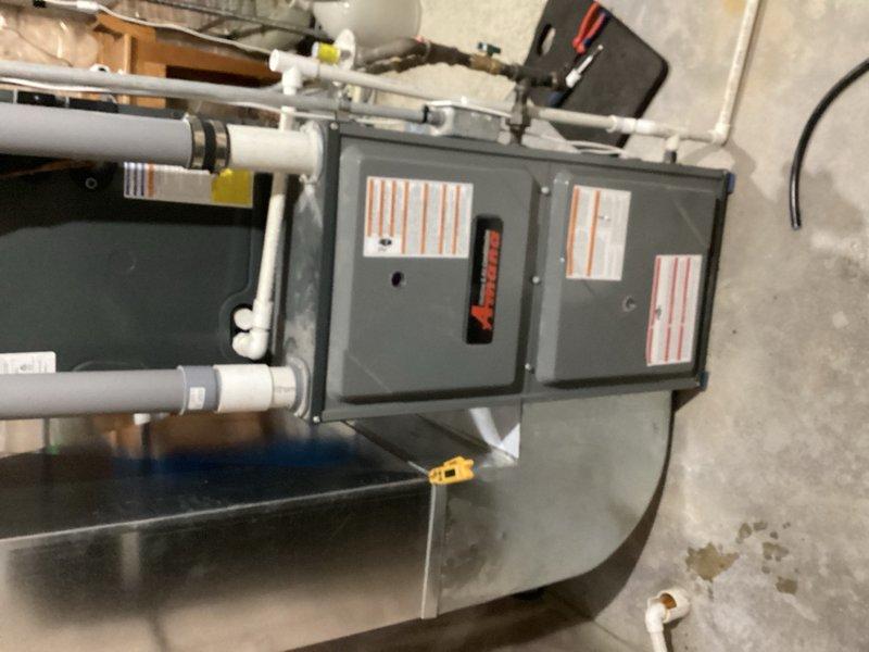 Responded to no cooling complaint on residential air conditioning system. Upon arrival, found condenser fan motor humming but not starting, requiring manual assistance to initiate operation. Diagnosed failed dual run capacitor exhibiting visible bulging, indicating internal failure. Removed and replaced defective capacitor with proper rated replacement. Verified condenser fan motor and compressor started properly without assistance. Checked system operation and confirmed unit cooling effectively with normal amperage draws on all components.