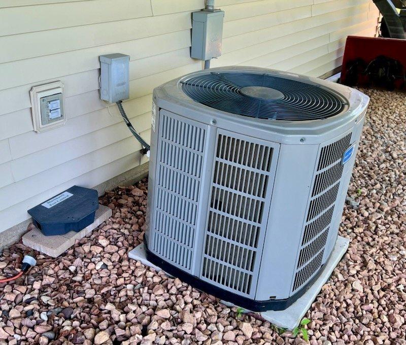 Responded to no cooling complaint on 9-year-old residential air conditioning system. Upon arrival, found evaporator coil frozen and blower motor not operating. Tested voltage at motor and confirmed power supply was adequate. Discovered loose electrical connection at blower motor plug; reconnected plug and motor began operating normally. Unable to assess refrigerant charge due to frozen coil condition. Instructed customer to turn system off, run furnace heat briefly to accelerate defrost, then operate fan only to complete coil thawing process before resuming cooling operation the following day. Advised customer to contact for follow-up service if issues persist after coil has fully thawed and system resumes normal operation.