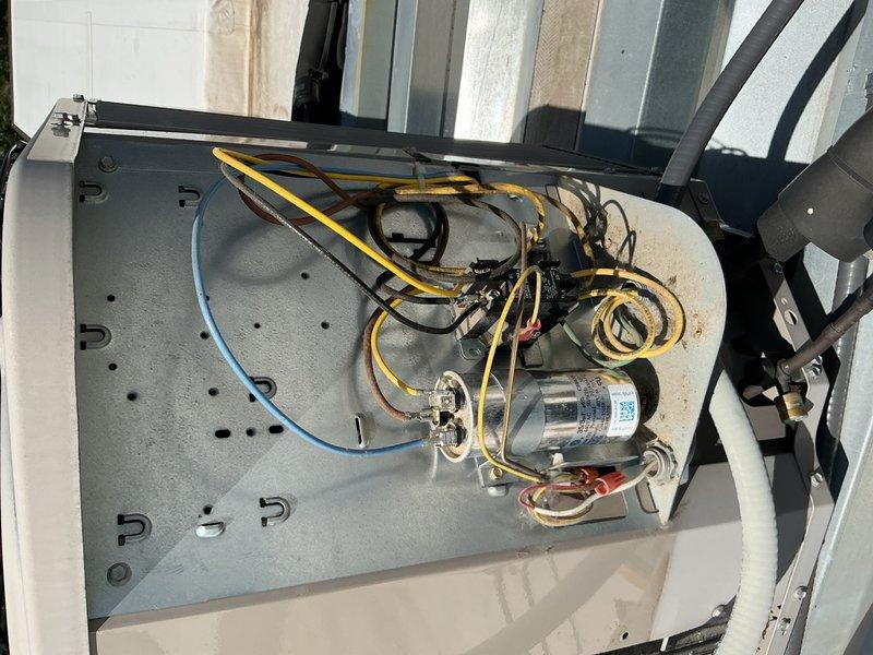 Responded to no cooling complaint on residential air conditioning system. Upon inspection, system was found to be operating but with insufficient refrigerant charge. Added UV dye tracer and recharged system to proper operating levels to restore cooling function. System now cooling adequately. Return visit required to perform UV dye leak detection and identify source of refrigerant loss.