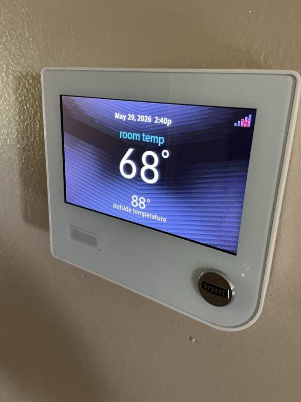 Completed annual AC maintenance tune-up on 14-year-old system under family rewards agreement. Performed comprehensive inspection, verified system operation with multimeter readings showing 33.51°F supply temperature, confirmed thermostat functionality displaying 68° room temperature with proper communication, and recommended hard start kit installation and comfort advisor consultation for aging equipment optimization.
