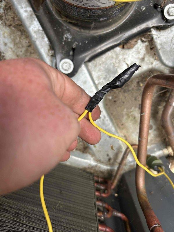 Responded to no cooling call on 2-3 year old system with outdoor unit not running and warm air at vents. Upon inspection, discovered rodent damage to pressure switch wiring with chewed insulation and exposed conductors. Repaired damaged wire with proper wire nut connection and electrical tape, then sealed all condenser access points with silicone to prevent future rodent intrusion. Tested system operation and confirmed outdoor unit running properly with normal cooling restored.