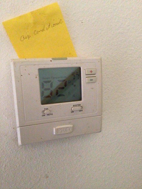 Responded to no cooling complaint on 14-year-old AC unit with reported loud knocking noise at startup and thermostat programming issues. Upon arrival, discovered property had separate thermostats for heating and cooling systems. Found analog heating thermostat dial set to 90 degrees, which was preventing cooling system from operating effectively. AC unit was cycling on properly but heat thermostat setting was overriding cooling function. Adjusted heating thermostat to lowest setting, verified AC unit engaged and began cooling properly. Confirmed system is now operating within normal parameters and providing adequate cooling to occupied space.