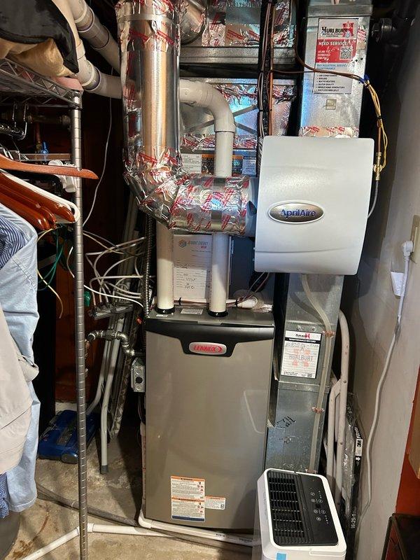 Responded to no-cooling complaint on newly installed Lennox system experiencing high pressure lockout. Found MERV 14 filter installed with inadequate airflow due to blower CFM remaining at default factory settings, which were lower than previous equipment specifications. Adjusted blower CFM settings via thermostat to accommodate high-MERV filtration and restore proper airflow through evaporator coil. Verified refrigerant circuit operation, measured temperature split across coil, and confirmed system cooling performance within manufacturer specifications. System operating normally with no further issues detected.