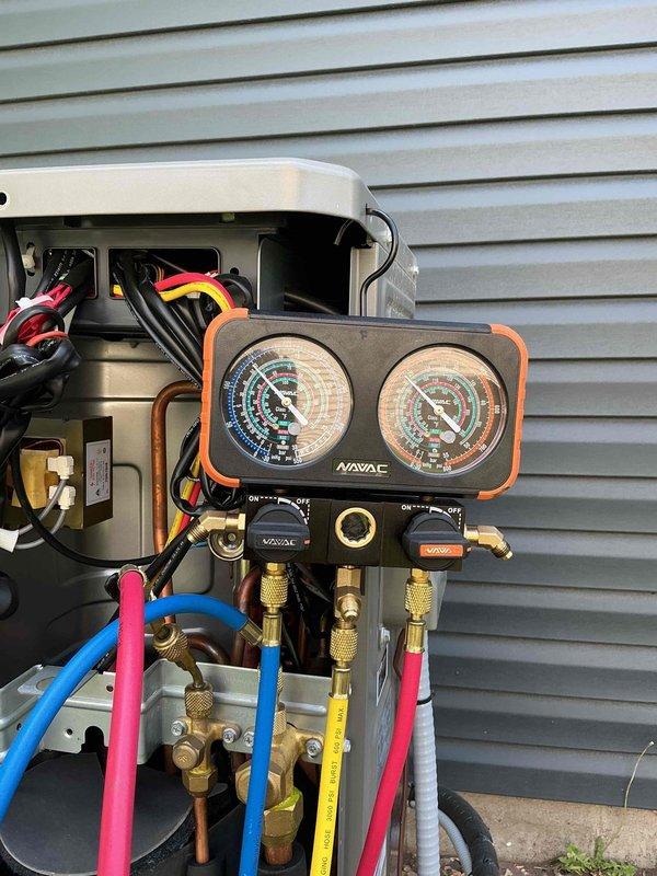 Responded to no cooling call on Lennox split system heat pump utilizing R-454B refrigerant. Upon inspection, identified active refrigerant leak at suction line flare connection. Tightened flare connection and added UV dye with refrigerant charge to system, which was found to be low. System requires follow-up visit to verify repair integrity and complete refrigerant charge adjustment.