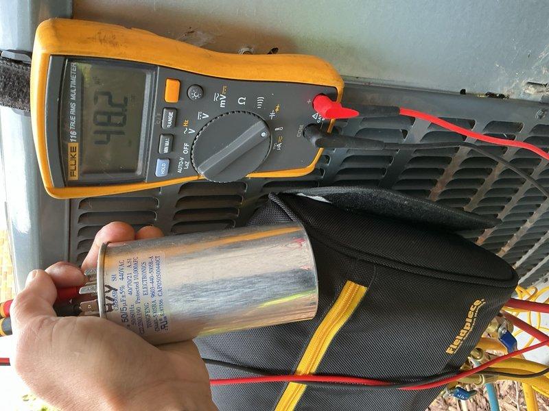 Responded to no cooling complaint on 6-year-old Goodman system installed in 2020. Upon arrival, homeowner reported unit began cooling after cleaning outdoor coil, but diagnostic testing revealed low refrigerant charge. System pressures measured 263 psi high side with 1°F subcooling and LSAT of 87°F, and 99 psi low side with 32°F superheat and VSAT of 31°F. Delta-T measured 20°F across evaporator coil. Verified blower operation, air filter condition, and outdoor coil cleanliness were all satisfactory. Testing confirmed refrigerant undercharge indicating potential leak in system. Presented three-step diagnostic plan option involving UV dye injection, refrigerant charge, and follow-up leak detection inspection. Homeowner declined immediate repair and requested written estimate for consideration.