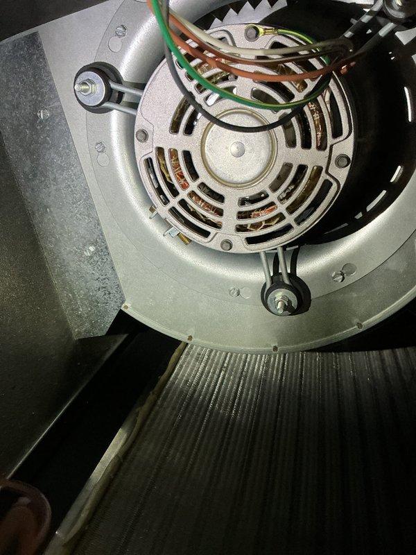 Completed annual air conditioning maintenance tune-up on 5-year-old Unico/Daikin AC system. Inspected blower motor assembly, verified proper operation, checked electrical connections, and replaced air filter. All components found in normal working condition with no deficiencies noted at this time.