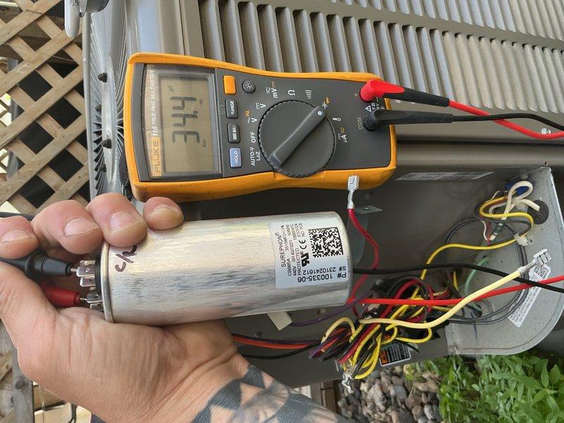 Responded to no cooling complaint on 2024 Lennox outdoor condensing unit. Upon arrival, confirmed indoor blower operating normally but no cooling occurring. Performed diagnostic evaluation of outdoor unit and observed compressor exhibiting abnormal operation with rattling noise and attempting to draw refrigerant improperly upon startup. Tested capacitor with multimeter to rule out electrical starting issues. Determined compressor has failed mechanically and requires replacement. Advised customer unit is still under manufacturer warranty coverage and recommended filing warranty claim for compressor replacement to restore system to proper cooling operation.