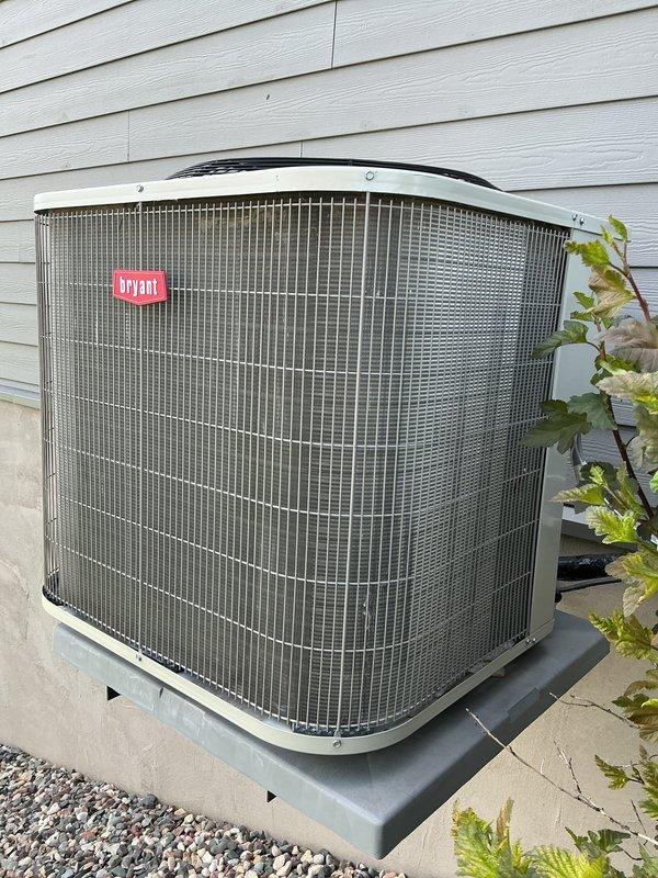 Responded to no cooling complaint on 5-year-old Bryant air conditioning system. Customer reported outdoor fan making abnormal noise indicating potential failure. Upon inspection, diagnosed failed dual run capacitor causing improper compressor and condenser fan motor operation. Removed defective capacitor and installed new dual run capacitor to manufacturer specifications. Tested system operation, confirmed proper compressor startup, verified condenser fan motor running at correct speed, and validated normal cooling cycle restoration. Unit returned to full operational status.