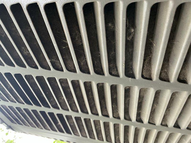 Responded to no cooling call on residential Bryant air conditioning system. Upon inspection, found dual run capacitor severely warped and reading 0 MFD on all three terminals (common, fan, and hermetic) when specification called for 35/5 MFD. Replaced failed capacitor and restored system to normal operation. Unit also showed significant debris accumulation on exterior coil requiring future maintenance attention.
