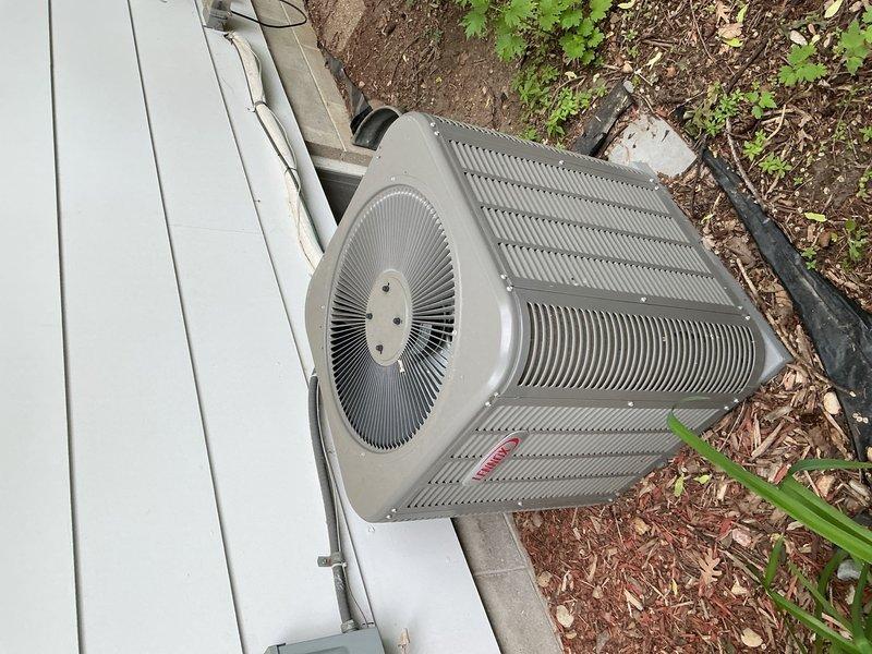 Responded to no cooling call on residential Bryant air conditioning system. Upon inspection, found dual run capacitor severely warped and reading 0 MFD on all three terminals (common, fan, and hermetic) when specification called for 35/5 MFD. Replaced failed capacitor and restored system to normal operation. Unit also showed significant debris accumulation on exterior coil requiring future maintenance attention.