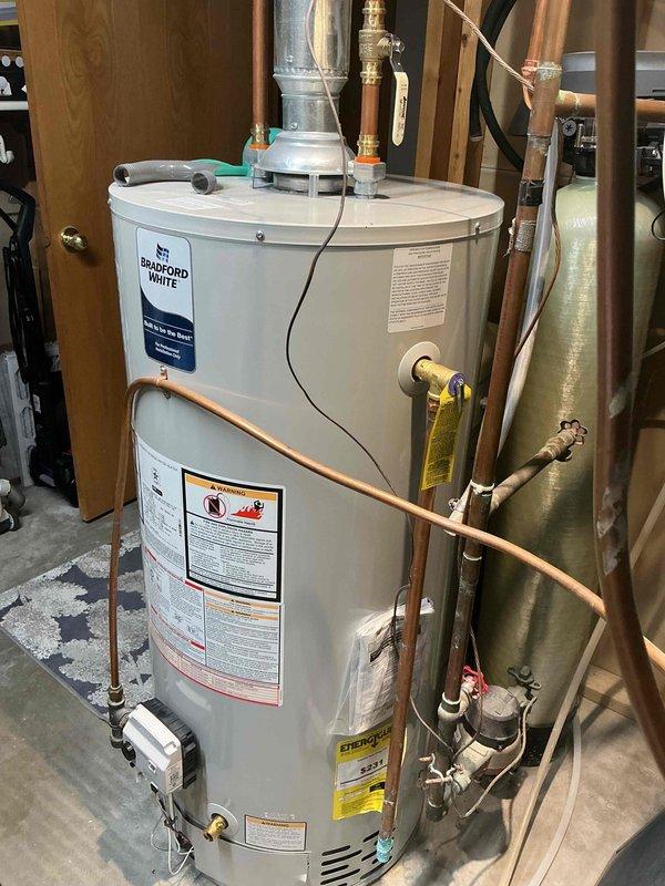 Completed seasonal AC tune-up and inspection, finding system operational but with significant coil buildup. Disassembled access panel, thoroughly cleaned evaporator coil to restore proper airflow and efficiency, and reassembled unit. Provided membership program information for future preventative maintenance services.