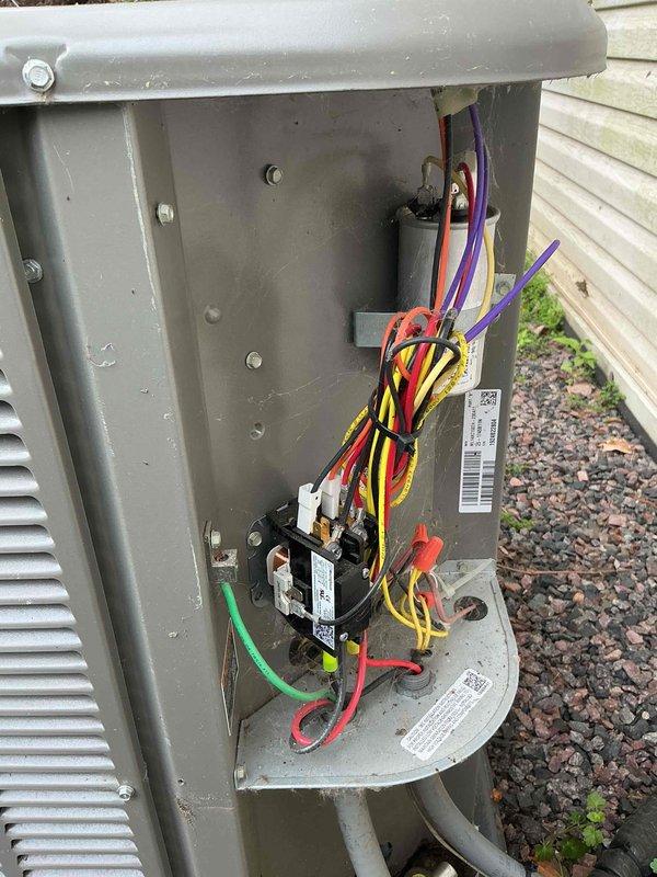 Completed seasonal AC tune-up and inspection, finding system operational but with significant coil buildup. Disassembled access panel, thoroughly cleaned evaporator coil to restore proper airflow and efficiency, and reassembled unit. Provided membership program information for future preventative maintenance services.