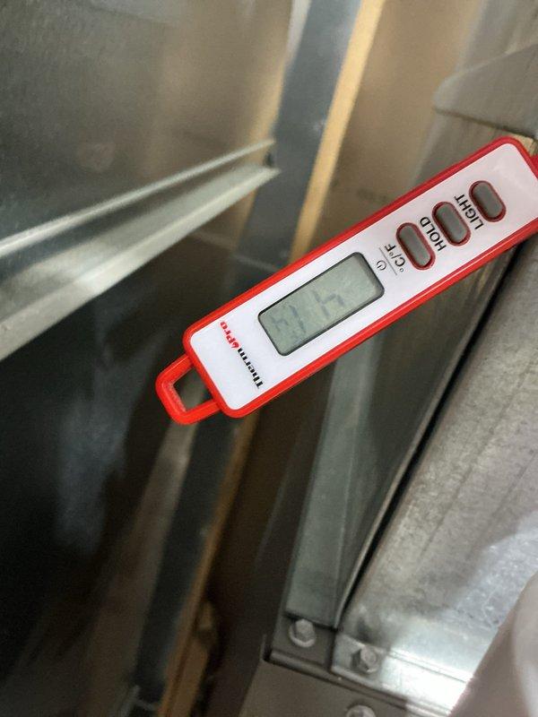 Responded to no cooling complaint on 2-3 year old system following recent maintenance visit. Upon arrival, found system not cooling adequately with evidence of previous freeze-up on evaporator coil. Performed diagnostic testing using refrigerant manifold gauges and confirmed system charge within proper specifications. Verified condenser coil clean and operating correctly. Identified airflow restriction caused by high MERV 12 filter combined with closed basement vents limiting return air. Instructed occupants to open basement vents to improve air circulation. Replaced restrictive filter with standard efficiency filter to restore proper airflow across evaporator coil. Verified blower operation and system cycling properly after corrections. System returned to normal cooling operation with adequate airflow and no further signs of freezing.