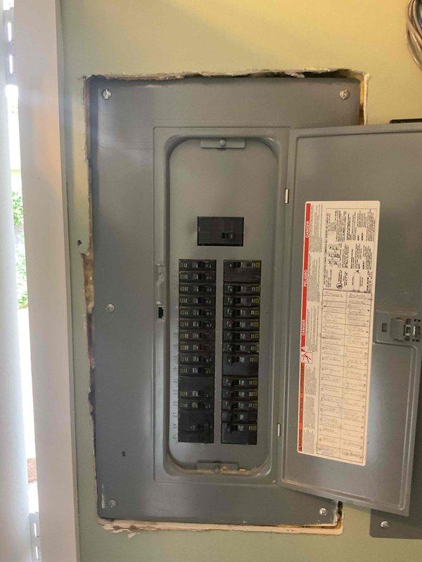 Responded to no cooling complaint on less than 10-year-old air conditioning system. Upon arrival, found unit breaker in off position following recent electrical work performed at property. Reset breaker to restore power to system. Evaluated system operation and found refrigerant charge slightly low. System now operational and cooling properly.