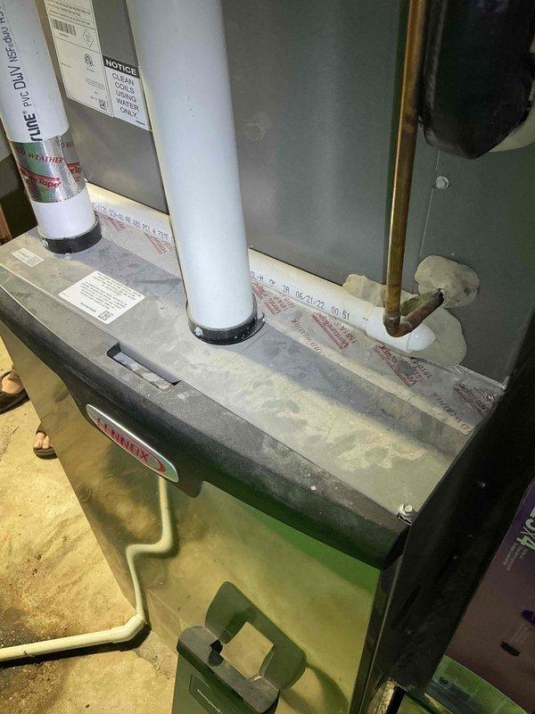 Responded to no cooling call on 1-2 year old Lennox heat pump system. Upon arrival, performed diagnostic inspection and found low refrigerant levels. System was operational but running with reduced cooling capacity. Checked refrigerant charge and identified deficiency requiring attention. Inspected indoor air handler unit and outdoor condenser components, documenting system condition with photos of control panel wiring and indoor equipment. Advised customer on proper air filter maintenance schedule due to presence of multiple pets in home, as inadequate filtration can lead to reduced airflow and system efficiency issues.