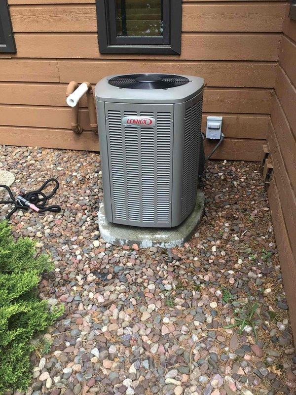 Performed comprehensive AC tune-up on 3-year-old Lennox unit. Customer reported excessive noise from outdoor condenser after recent startup. Upon inspection, discovered completely plugged air filter, likely due to cottonwood debris on property. Washed condenser coil, performed full electrical inspection with all components testing within normal parameters, and replaced clogged filter. System noise levels returned to normal operation following service completion.