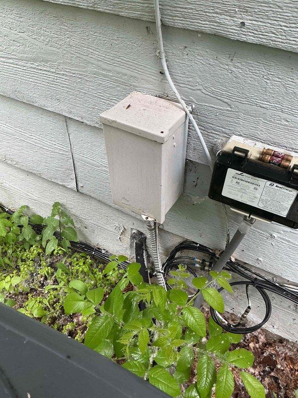 Responded to no cooling call on 10+ year old AC unit. Previous technician had identified electrical issue and recommended electrician involvement. Upon arrival, verified power present at breaker and confirmed replaced fuses were intact, but measured only approximately 25 volts at unit instead of required 240 volts. Inspected exterior disconnect box, electrical conduit, and main electrical panel. Documented low voltage condition and confirmed need for licensed electrician to diagnose and repair upstream electrical supply issue before AC system can be properly evaluated or restored to operation.