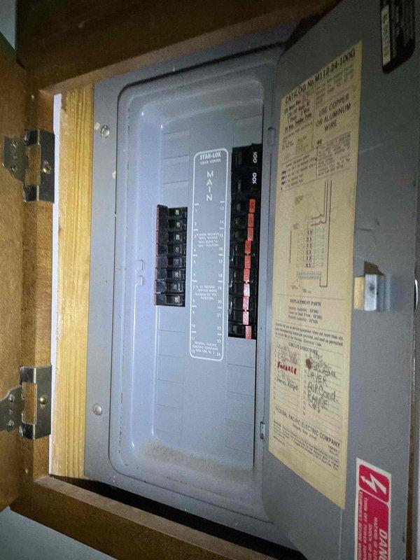 Responded to no cooling call on 10+ year old AC unit. Previous technician had identified electrical issue and recommended electrician involvement. Upon arrival, verified power present at breaker and confirmed replaced fuses were intact, but measured only approximately 25 volts at unit instead of required 240 volts. Inspected exterior disconnect box, electrical conduit, and main electrical panel. Documented low voltage condition and confirmed need for licensed electrician to diagnose and repair upstream electrical supply issue before AC system can be properly evaluated or restored to operation.