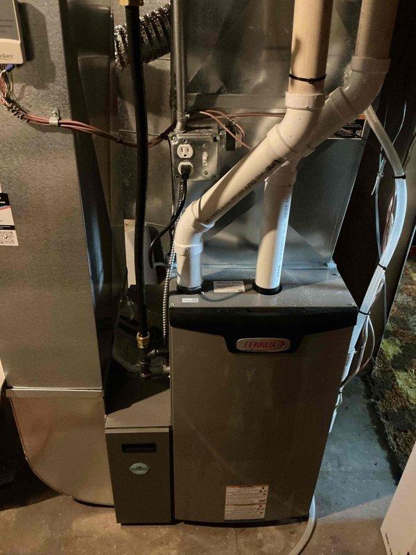 Responded to no cooling call on 10-year-old Lennox central air conditioning system with outdoor unit not running and no airflow at registers. Diagnosed failed start capacitor on condensing unit preventing compressor operation. Replaced defective start capacitor with OEM equivalent and monitored full system operation through complete cooling cycle to verify proper compressor startup, airflow delivery, and temperature differential across evaporator coil.