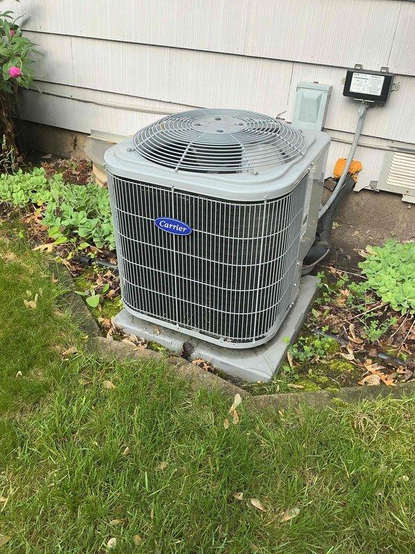 Completed annual maintenance inspection on 5-year-old Carrier air conditioning system. Performed comprehensive system evaluation including capacitor testing, contactor inspection, compressor and fan motor amp draw measurements, refrigerant charge verification, control board assessment, and airflow analysis. Verified 19-degree temperature split across evaporator coil, inspected and confirmed clean air filter and evaporator coil condition. All components tested within manufacturer specifications and system operating properly with no deficiencies identified or recommendations required at this time.