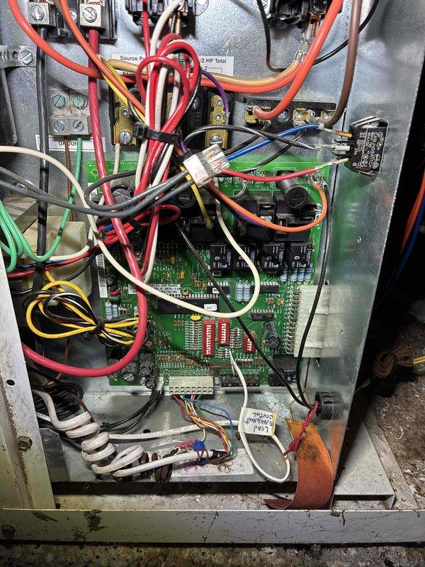 Responded to no cooling call on geothermal system. Customer reported manually jumping ECM blower motor for several weeks to initiate operation as control board was not sending signal to motor start wire. Upon arrival, found unit non-operational with no diagnostic lights illuminated, indicating failed control board. Tested compressor operation in heating mode - unit ran successfully. Attempted cooling mode operation resulted in pumps running 10-15 seconds before system lockout, but unable to determine specific fault code due to non-functioning diagnostic LED display. Verified condensate drain clear, checked loop pressures within normal range, and confirmed adequate refrigerant charge with no low pressure safety trips. Diagnosed primary failure as control board requiring replacement to restore ECM blower operation and proper system diagnostics. Advised customer that additional issues may be present but cannot be properly diagnosed until control board is replaced and diagnostic functions 