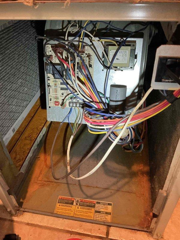 Responded to a no cooling callback where the outdoor unit was not running. Previous technician had visited, and customer subsequently installed a new thermostat, but system remained inoperative. Diagnosed issue by jumpering thermostat wires at air handler, which successfully activated the air conditioning system, confirming the newly installed thermostat was defective. Verified all electrical connections and system operation. Customer elected to purchase and install replacement thermostat independently. System confirmed operational when proper thermostat control signal present.
