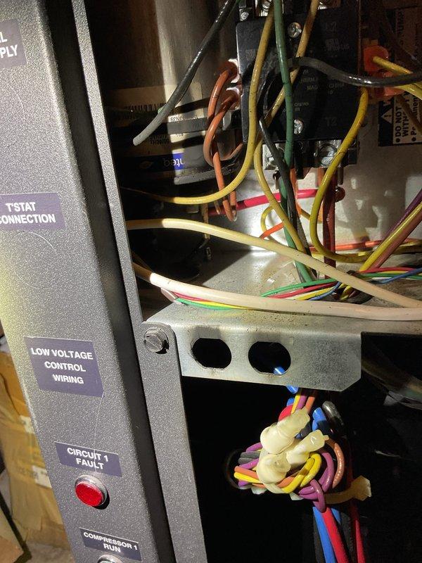 Responded to no cooling condition on geothermal heat pump system. Found failed run capacitor and hard start capacitor with burned wiring connections. Replaced both capacitors, repaired damaged wiring, and performed test run with satisfactory operation. Unit running properly at time of departure, though compressor longevity may be affected by component failures.
