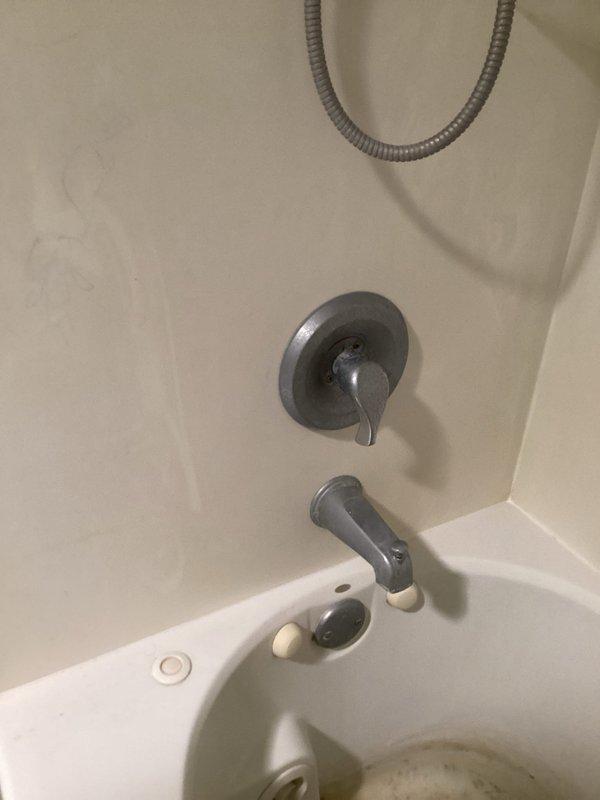 Responded to service call for malfunctioning shower faucet cartridges in two separate shower units. Upon inspection, determined that cartridges had failed due to mineral buildup and sediment damage caused by a non-functioning water softener system. Replaced defective cartridges in both shower valve assemblies and installed new water softener unit to prevent future cartridge deterioration and ensure proper water quality throughout the plumbing system.
