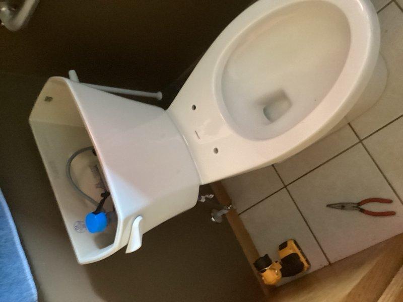 Responded to service call for toilet replacement consultation. Assessed existing standard toilet and provided estimate with multiple options for replacement. Customer selected ADA-compliant tall elongated toilet model. Proceeded with complete toilet removal and replacement, installing new ADA-height elongated bowl unit with all necessary hardware, wax ring, and water supply connections. Tested for proper flush operation and verified no leaks at base or supply line connections upon completion.