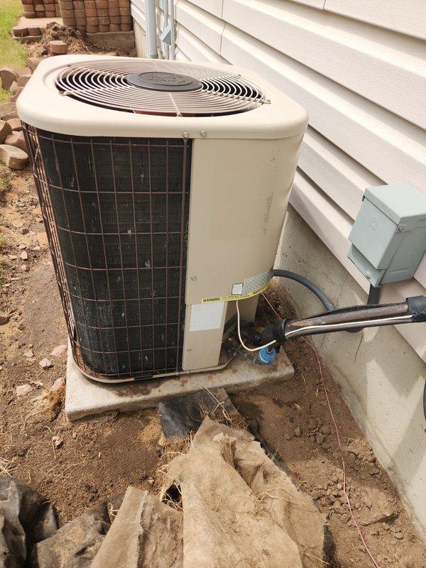 Responded to no cooling complaint on 15+ year old air conditioning system. Upon inspection, found inadequate cooling with only 10° temperature split across evaporator coil and freezing distributor tubes. Diagnostic testing revealed suction pressure at approximately 40 PSI, indicating significant refrigerant undercharge in R22 system. Due to phase-out of R22 refrigerant and age of equipment, advised customer that system replacement is most viable option. Coordinated with sales team for replacement system evaluation and pricing.