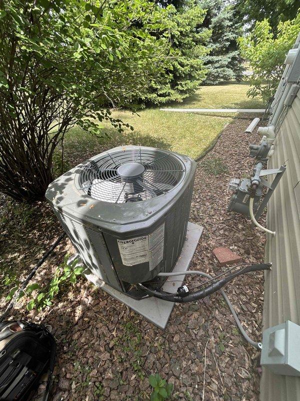 Responded to no cooling complaint on two-year-old Trane central air system. Upon arrival, found outdoor condenser unit inoperative with furnace blower running but no cold air production. Discovered electrical disconnect had been left in the off position following recent siding work performed by contractors near the outdoor unit. Restored power by turning disconnect back on, verified proper system startup, and confirmed unit cycled normally with adequate cooling operation restored.