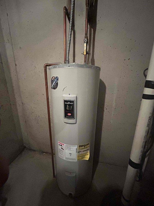 Responded to no cooling complaint on two-year-old Trane central air system. Upon arrival, found outdoor condenser unit inoperative with furnace blower running but no cold air production. Discovered electrical disconnect had been left in the off position following recent siding work performed by contractors near the outdoor unit. Restored power by turning disconnect back on, verified proper system startup, and confirmed unit cycled normally with adequate cooling operation restored.