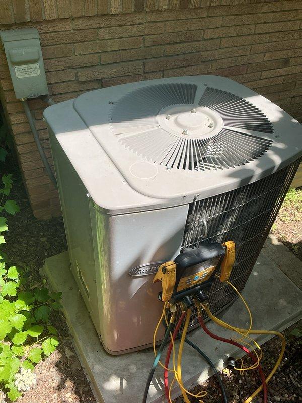 Responded to no cooling complaint on 27-year-old residential air conditioning system. Upon arrival, connected manifold gauges and performed system diagnostics, confirming unit was low on R22 refrigerant. System utilizes obsolete R22 refrigerant which is no longer stocked or available for service. Explained that due to the age of the equipment and unavailability of compatible refrigerant, repair options are not viable. Presented system replacement options as the recommended solution to restore cooling functionality.