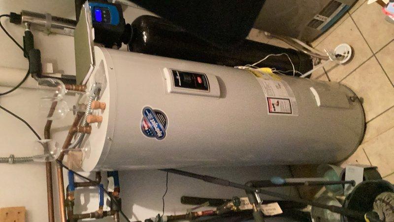 Responded to service call for water softener not cycling through salt properly. Upon inspection, discovered a salt bridge formation in the brine tank preventing proper regeneration cycle. Broke up and removed the salt bridge to restore normal water softener operation. Verified system functionality and proper brine draw after repair. Coordinated entry access remotely per customer instructions as property was unoccupied during service visit.