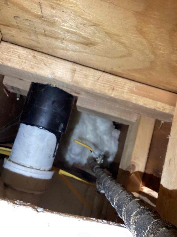 Responded to outdoor spigot leaking inside the home. Upon inspection, found that a hose had been left connected to the exterior spigot over winter, causing the pipe to freeze and split. The frozen expansion resulted in a ruptured supply line behind the wall, allowing water to leak into the interior of the home. Documented the damaged piping and provided quote for complete spigot and pipe replacement to resolve the issue.