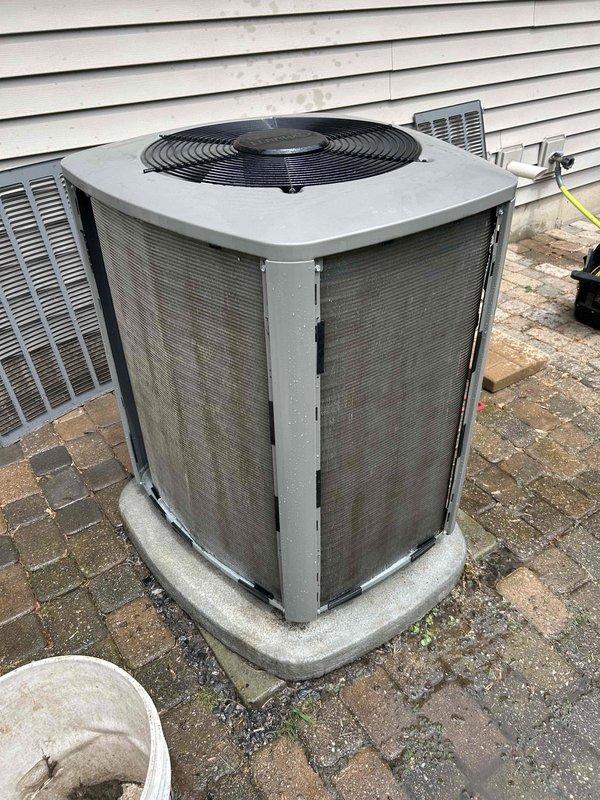 Responded to no cooling complaint on 2-year-old air conditioning system. Upon inspection, found outdoor condenser coil completely blocked with accumulated dirt, dust, and debris, causing reduced airflow and inefficient operation. Thoroughly cleaned and rinsed condenser coil, removing heavy buildup from front panel and mesh screens. After cleaning, verified system operation with proper temperature split of 20° across evaporator coil and correct subcooling readings, confirming refrigerant charge within manufacturer specifications. Unit operating quietly with restored cooling capacity. Advised homeowner on importance of regular coil maintenance to prevent future performance issues.