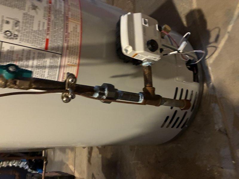 Responded to service call for leaking natural gas water heater with tank failure at bottom of unit. Removed and disposed of failed 50-gallon residential water heater that was actively leaking from compromised tank. Completed full replacement installation of new natural gas water heater, including all necessary plumbing connections, gas line hookup, venting, and electrical controls to restore hot water service to the residence.