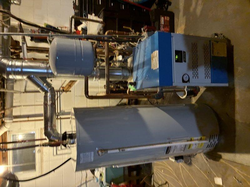 Responded to service call for leaking natural gas water heater with tank failure at bottom of unit. Removed and disposed of failed 50-gallon residential water heater that was actively leaking from compromised tank. Completed full replacement installation of new natural gas water heater, including all necessary plumbing connections, gas line hookup, venting, and electrical controls to restore hot water service to the residence.