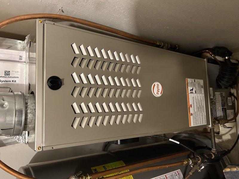 Responded to warranty callback for loud thunking noise occurring at system startup on recently installed air conditioning system. Diagnosed source of noise as ductwork popping at filter slot location above evaporator coil where modifications were made during initial installation. Secured ductwork by installing additional screws and adding slip connector section to reinforce and stabilize the affected area, eliminating the noise issue. System tested and verified operating properly with no further abnormal sounds detected.